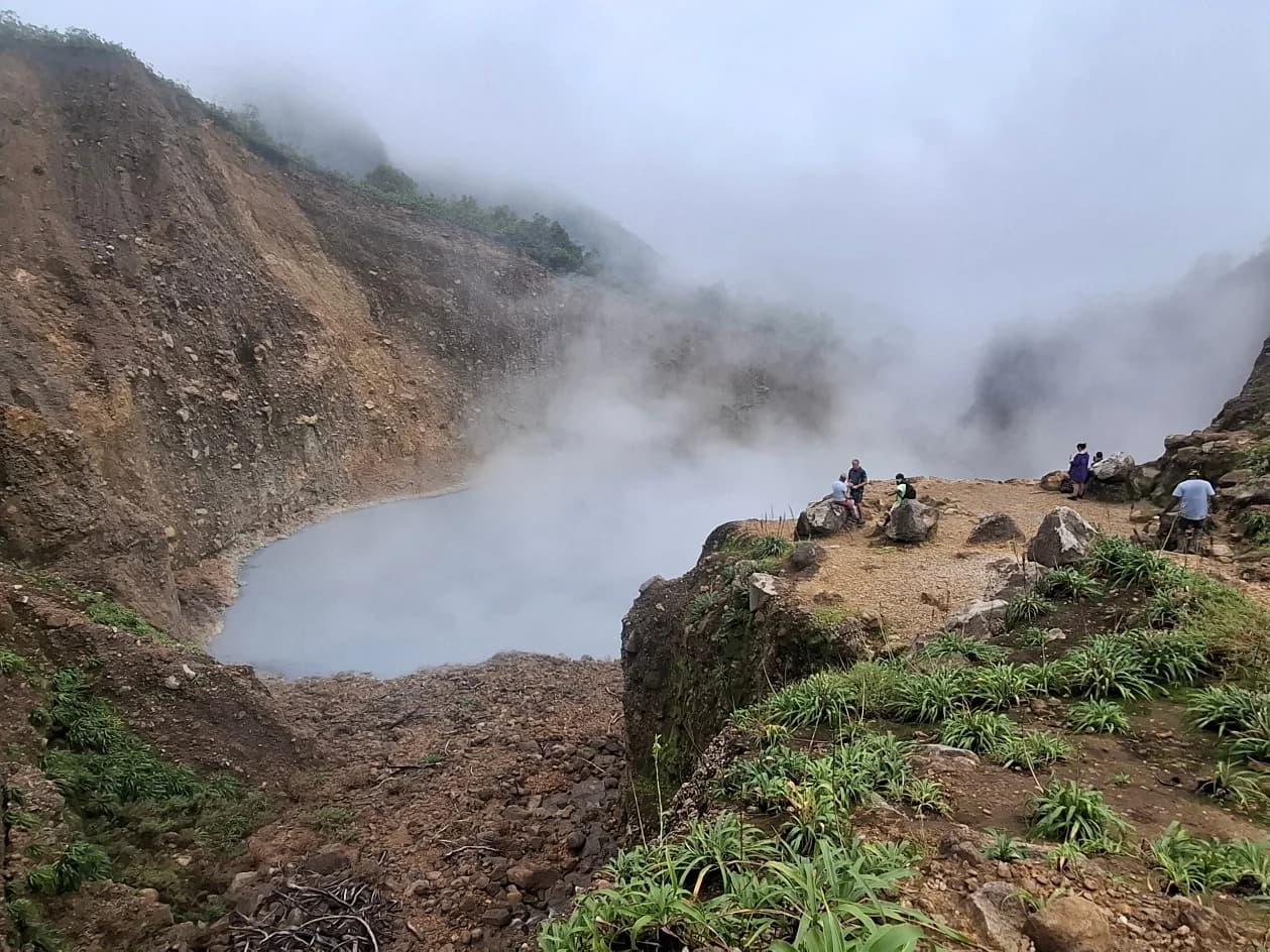 Shared guided Boiling Lake hike group on the volcanic trail in Dominica's rainforest